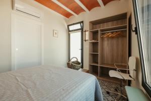 Postel nebo postele na pokoji v ubytování Casa Victoire Ayamonte