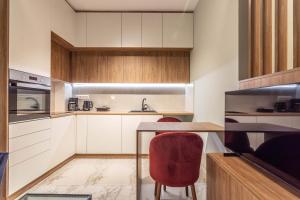 Kuchyň nebo kuchyňský kout v ubytování Cozy Apartment - 8' To Panormou Metro Station + 13 fotografií