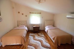 A bed or beds in a room at Villa River Village
