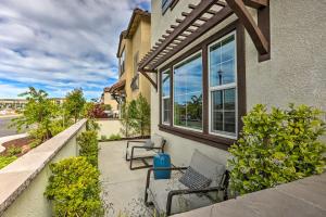 a patio with two chairs and a building at Relaxing Roseville Home with Outdoor Amenities in Roseville