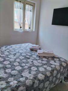 Giường trong phòng chung tại I 23 PASSI Marina di Minturno