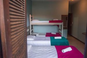 Postel nebo postele na pokoji v ubytování Hotel Pousada Capão