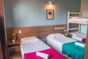 Postel nebo postele na pokoji v ubytování Hotel Pousada Capão