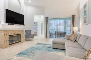 a living room with a couch and a fireplace at Golf Course Estates in Davenport