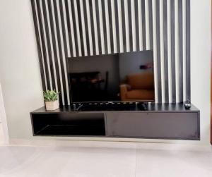 a living room with a mirror on a wall at Vacation home near the sea in Durrës