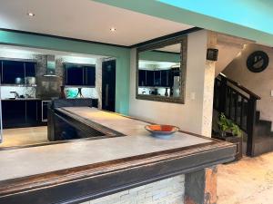 a kitchen with a counter with a bowl on it at Kudu 5 Willards Beach Ballito in Ballito