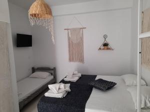 Postel nebo postele na pokoji v ubytování Orama Thassos