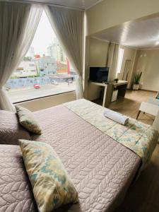 מיטה או מיטות בחדר ב-Hotel Zata e Flats