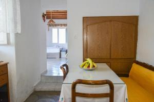 a kitchen with a table with a bowl of bananas on it at XALAKAS SUMMER HOUSE in Empourios