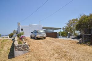 a car parked in front of a building at XALAKAS SUMMER HOUSE in Empourios