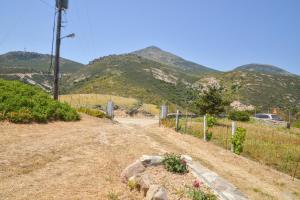a dirt road with mountains in the background at XALAKAS SUMMER HOUSE in Empourios