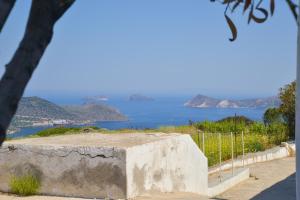 a view of the ocean from a rock wall at XALAKAS SUMMER HOUSE in Empourios