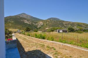 a garden with mountains in the background at XALAKAS SUMMER HOUSE in Empourios