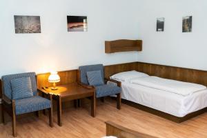 A bed or beds in a room at Gasthof Filzwieser