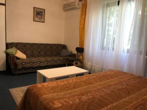 a living room with two beds and a couch at Madam Svetlana in Tivat
