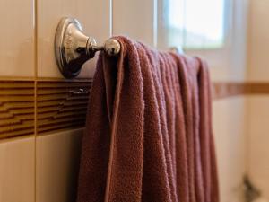 a towel hanging on a towel rack in a bathroom at Apartment Village house in Ravno +51 photos