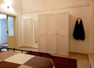 A bed or beds in a room at Casa Santa Maria - Beautifully restored house in centro storico Irsina Basilicata Puglia