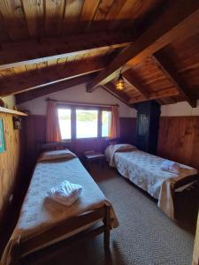 Una cama o camas cuchetas en una habitación  de Hotel Angostura