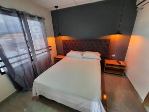 Postel nebo postele na pokoji v ubytování Hotel Almalu
