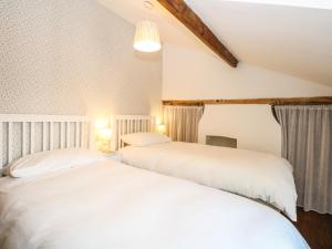 Кровать или кровати в номере 1 Chelsea Cottage