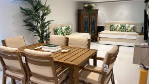 a dining room with a wooden table and chairs at Apartamento Sea View 503B in San Andrés
