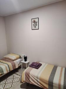 Postel nebo postele na pokoji v ubytování Apartman Tramonto