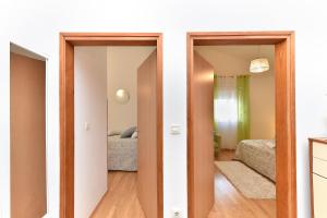 Łóżko lub łóżka w pokoju w obiekcie House Kacana 2163
