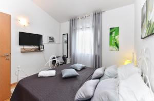 Łóżko lub łóżka w pokoju w obiekcie House Kacana 2163