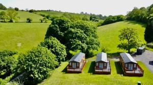 an overhead view of a group of cottages in a field at Lillypool Lodges in Cheddar