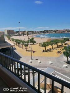 a view of a beach from a balcony at Riells playa in L'Escala