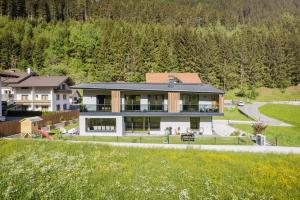 a large house with a lot of windows at Apartment Mountainview in Neustift im Stubaital