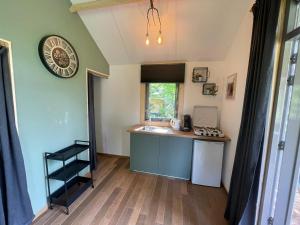 a kitchen with a counter and a sink in a room at Trekkershut - 4 personen in Beilen
