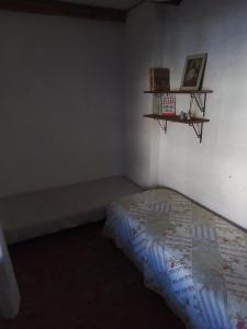 Giường trong phòng chung tại La casa de Merce
