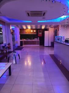 a large room with a bar and a restaurant at Hotel Sri Sutra PJ 222 in Petaling Jaya