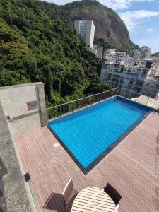 a swimming pool on top of a building at Royalty Copacabana Hotel in Rio de Janeiro