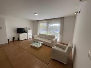 TV a/nebo společenská místnost v ubytování Adriatic Queen Rooms & Apartments