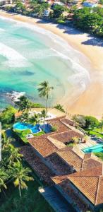 an aerial view of the beach and the ocean at Bravacasa Geriba B&uacute;zios Luxury Inn in B&uacute;zios