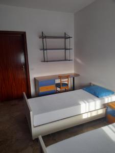 Säng eller sängar i ett rum på Casa vacanza in colline abruzzesi