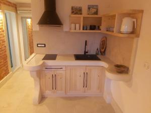 a kitchen with a sink and a counter at 2022 RENOVATED apartment on the beach in Poljana