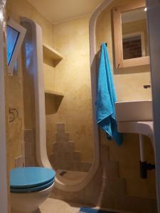 a bathroom with a toilet and a sink at 2022 RENOVATED apartment on the beach in Poljana