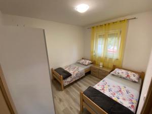 Posteľ alebo postele v izbe v ubytovaní Kraljević Apartments