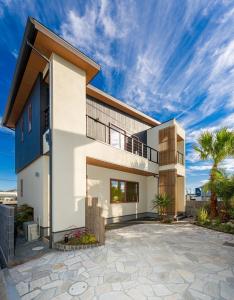 a house with a patio in front of it at J1 wellness - Vacation STAY 62605v in Tateyama