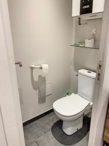 a bathroom with a white toilet in a room at LE DONJON Villa BDSM Port Nature VILLAGE Cap d'Agde naturiste in Cap d'Agde