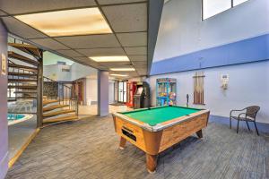 a pool table in the middle of a room at Beech Mountain Condo Near Hiking and Mountain Biking in Beech Mountain