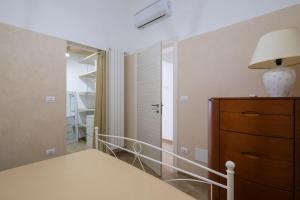 Ένα ή περισσότερα κρεβάτια σε δωμάτιο στο Casa di Gigi