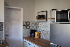 Kuchyň nebo kuchyňský kout v ubytování Apartmani Nana Mija