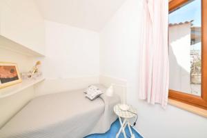 A bed or beds in a room at A' casa 'e Carmeniello