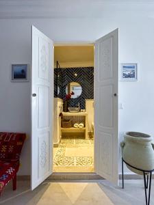 Letto o letti in una camera di Dar Colibri - Maison d'hôtes à Kélibia