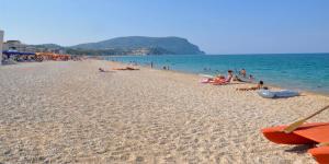 a group of people laying on a beach at A casa di Nonna Maria in Marcelli