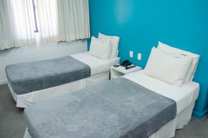 เตียงในห้องที่ Bahia Sol e Mar